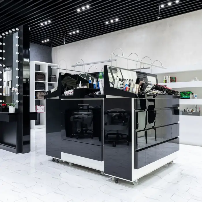 A bright beauty and personal-care store with a glossy display island and white shelves